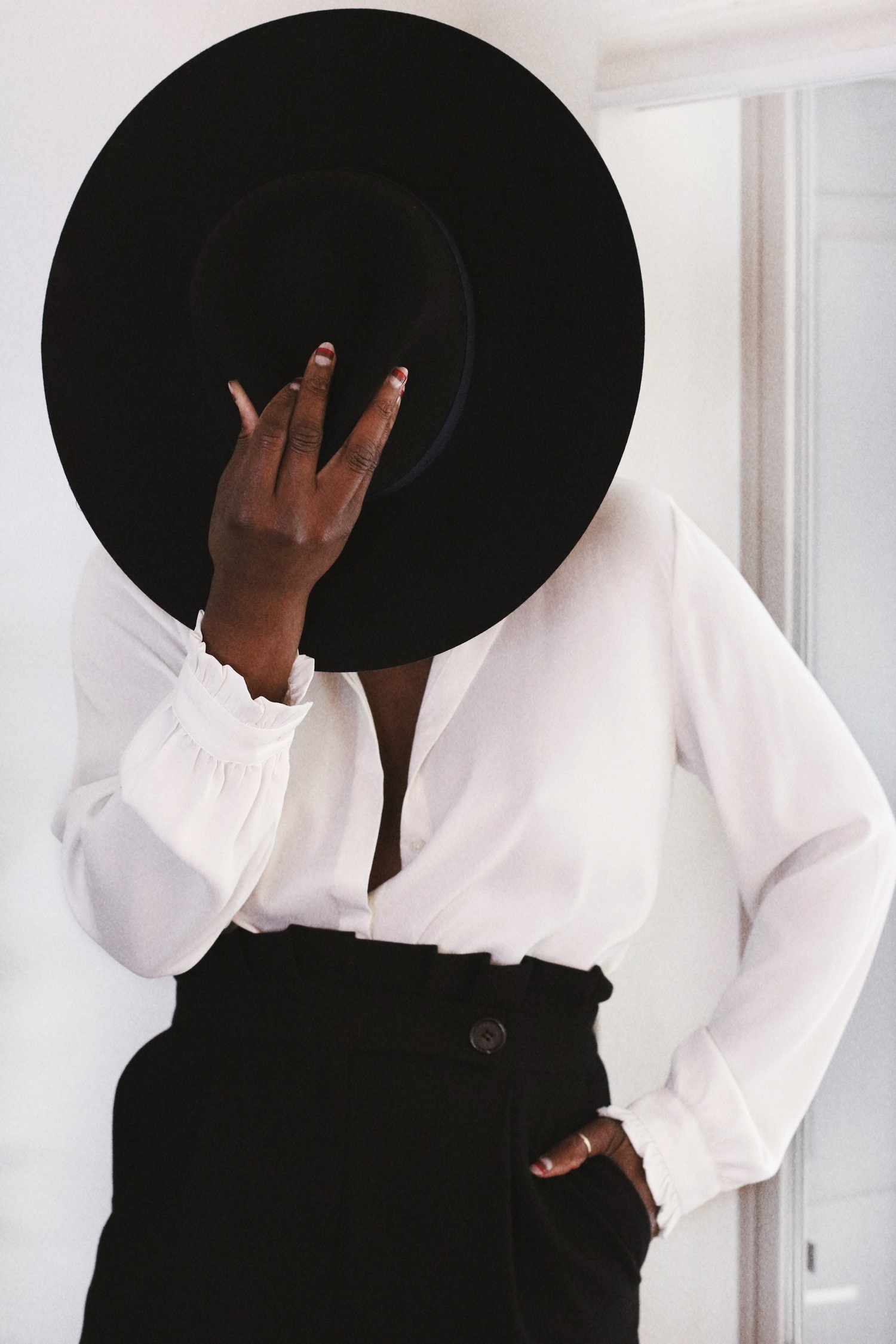 Black women shop in hats